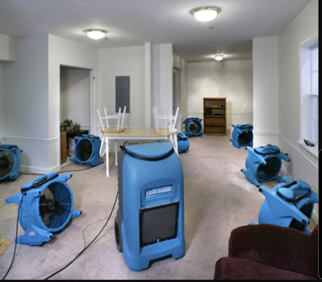 Air movers and dehumidifier setup for Water Damage Restoration in Etowah